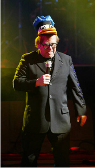 Sir Elton John performing at the Old Vic Theatre wearing a Donald Duck hat, London, February 5, 2003