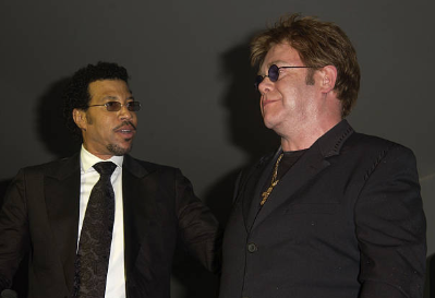Lionel Richie and Elton John at Cinema Against AIDS 2003 during Cannes Film Festival at Moulin de Mougins, France