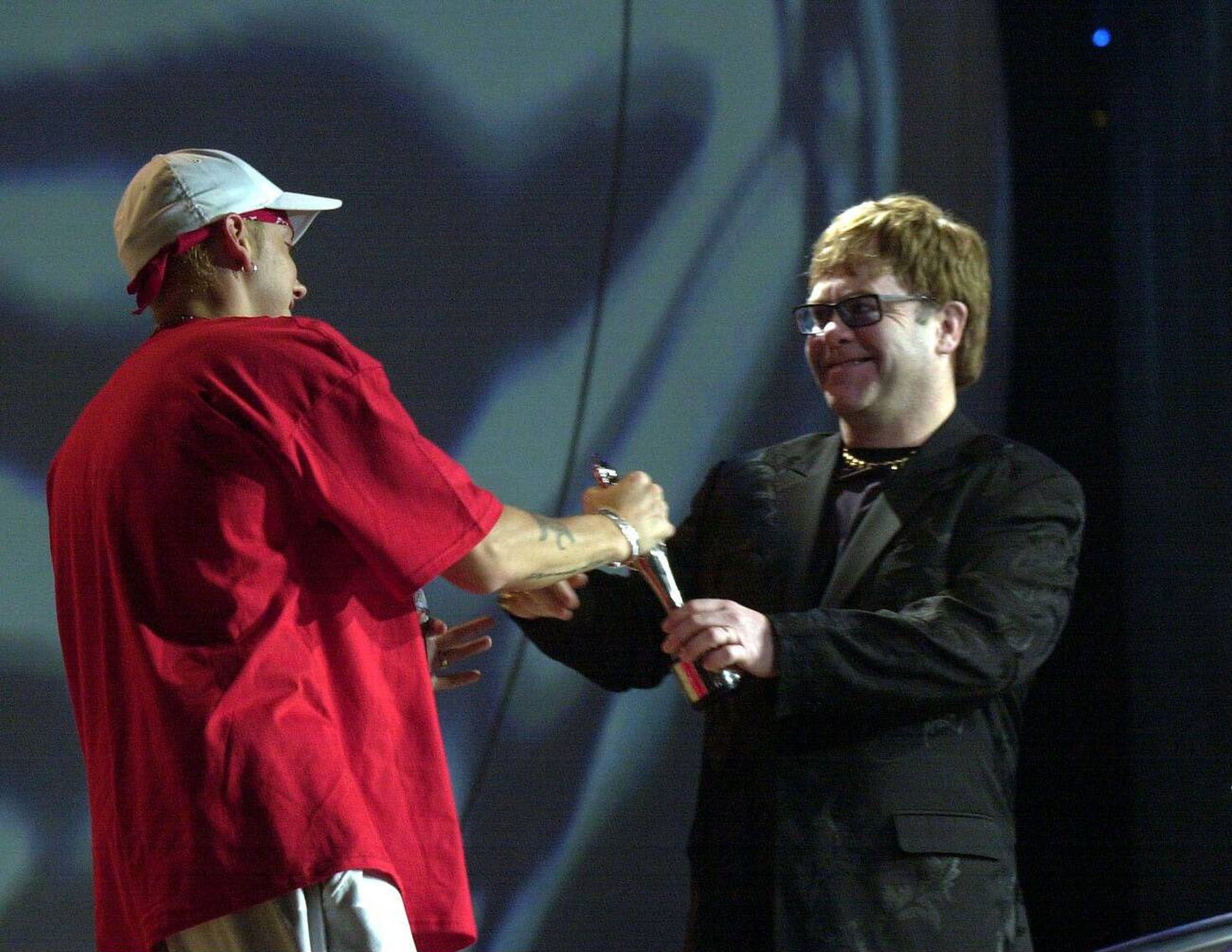 Elton John presenting award to Eminem at Brit Awards 2001