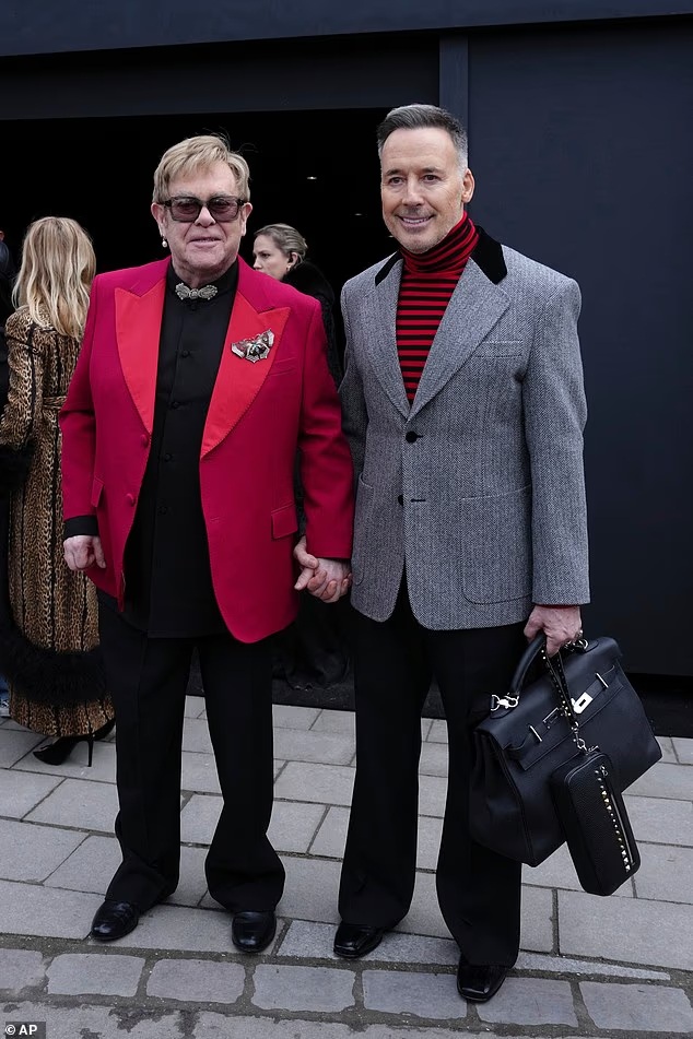 Elton John and David Furnish at the Valentino show in Paris