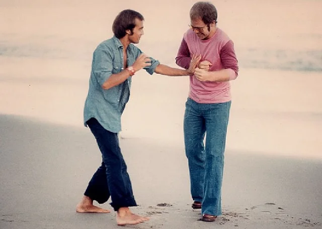 Elton John and Bernie Taupin on the beach, August 1972.