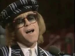 Elton John on the Morecambe and Wise Christmas Special in 1977.
