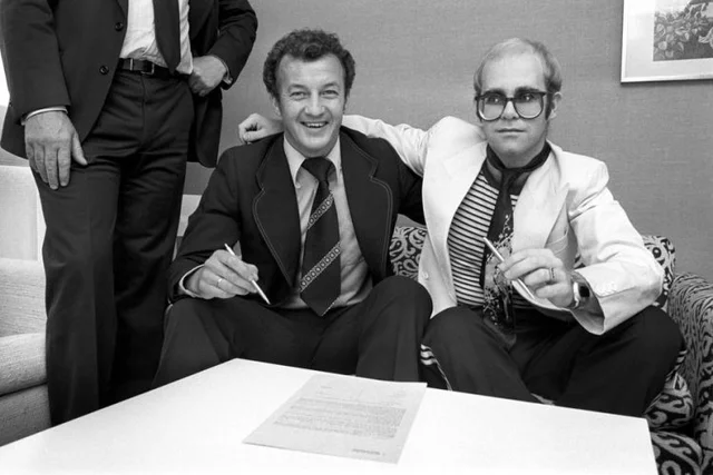 Elton John signs contract employing him as Watford F.C. chairman