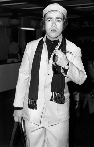 British pop singer Elton John leaves London's Heathrow airport for New York, on October 8, 1978 in London for promotion in America