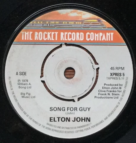 Mar 1979 US 45 MCA 40993 (did not chart) SONG FOR GUY *LOVESICK Arranged and Conducted by Paul Buckmaster. Ray Cooper: tambourine.