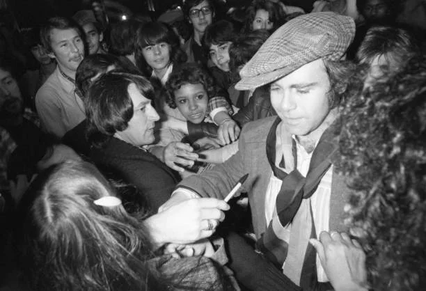Elton John in Paris in 1979 Elton John signs autographs after his concert at the Théâtre des Champs-Élysées in Paris on February 20, 1979, France.