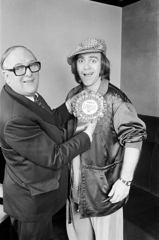 Denis Howell Labour Minister of State for Sport with pop star Elton John. They are pictured together in Birmingham before Elton appeared in a concert. 22nd April 1979.