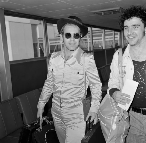 Elton John arriving at Heathrow Airport, from Los Angeles. He has been on a ten week tour of California. Picture taken 29th October 1973
