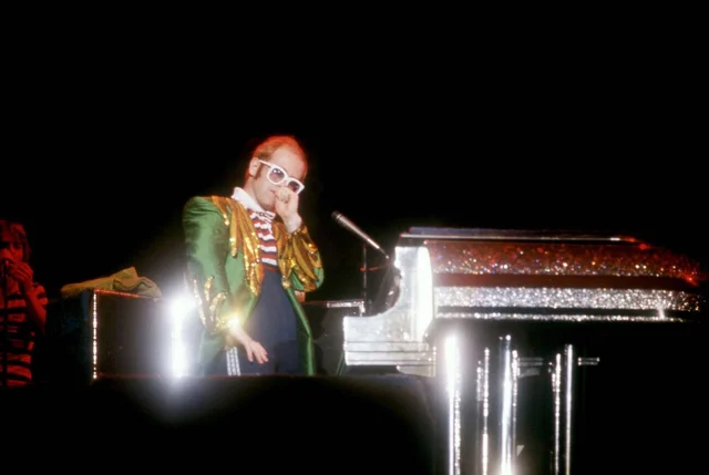 PONTIAC - JULY 11: English singer, songwriter, pianist and composer, Sir Elton John, performs at the Pontiac Silverdome during his "Louder Than Concorde" tour, on July 11, 1976, in Pontiac, Michigan