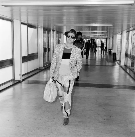 Elton pictured arriving at Heathrow Airport from Los Angeles. He has arrived home to watch Watford play a match tonight and will return to Los Angeles tomorrow. He said "I must be crazy to fly all this way to watch a match which will be fogged-off"