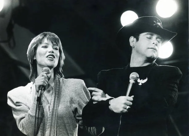 Elton John And Kiki Dee Elton John and Kiki Dee, Hitring Plage (Belgian TV show), Blankenberge, Belgium , 21st August 1981.
