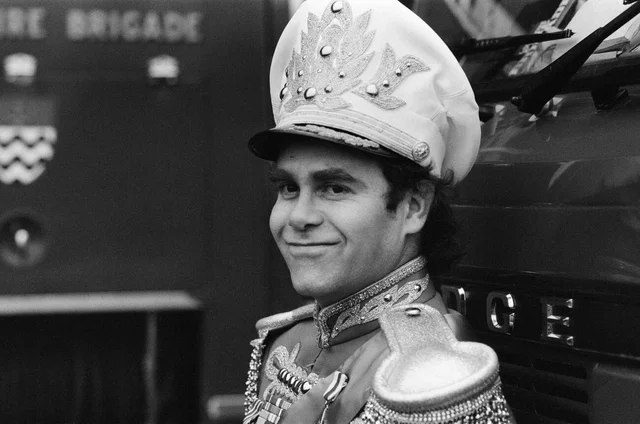 elton john pictured before he sets off on his first major british tour for five years he is dressed in one of the outfits he will be wearing on the tour 31st october 1982