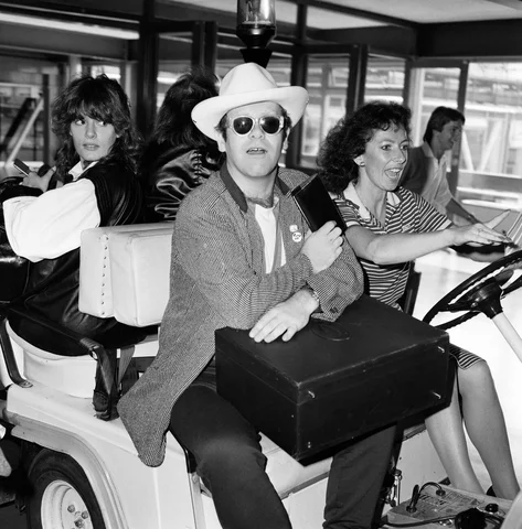 elton john pictured at heathrow airport 1st june 1982