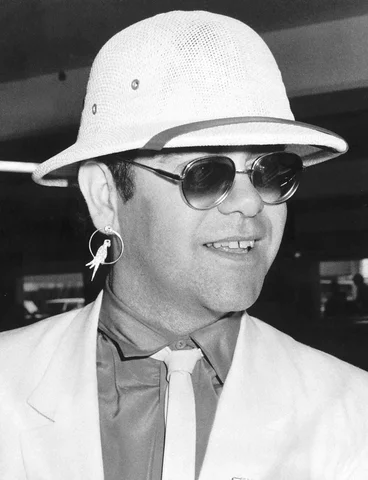 Elton John singer arriving at Heathrow from Sun City South Africa August 1983