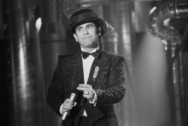 English singer, songwriter, pianist, and composer Elton John performing at the Channel 4 Christmas Show, UK, 12th December 1983