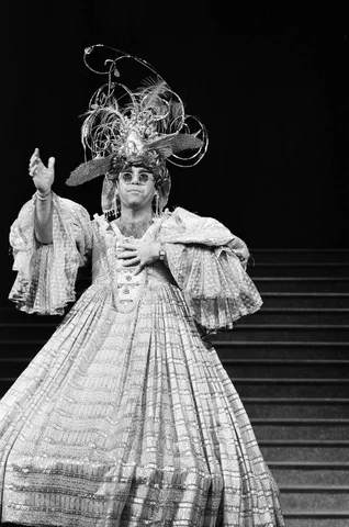 Elton John brings the house down singing "There Ain't Nothing Like a Dame" in a charity show at London's Theatre Royal. 2nd December 1984.