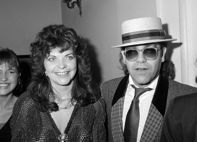 LONDON, UK. Sept 1985: Pop star Elton John & wife Renate Blauel in London