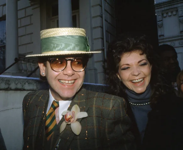 British Musician Elton John With His Wife British singer, pianist and composer Elton John with his wife, the German recording engineer Renate Blauel, in London, circa 1985.