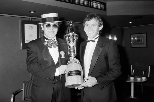 Elton John and Peter Reid Peter Reid of Everton FC with Elton John at the PFA Players' Player of the Year event. Peter Reid won the PFA Player of the Year award, 24th March 1985.