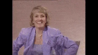 An angelic Elton John talked wigs and gigs with Esther Rantzen on Wogan. 1986