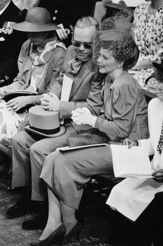 English singer Elton John and his wife Renate at the royal wedding of Prince Andrew and Sarah Ferguson at Westminster Abbey in London, 23rd July 1986.