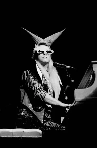 Elton John performs onstage at the Poplar Creek Music Theater, Chicago, Illinois, August 23, 1986