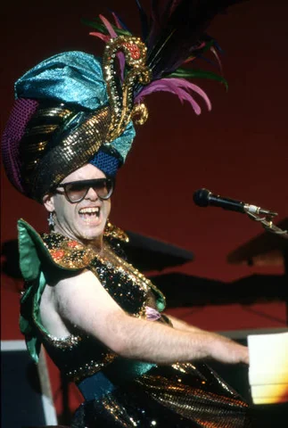 Elton John In Clarkston, MI DETROIT - AUGUST 18: English singer, songwriter, pianist and composer, Sir Elton John, performs at Pine Knob Music Theatre during his "Fire and Ice Tour," on August 18, 1986, in Clarkston, Michigan, a suburb of Detroit