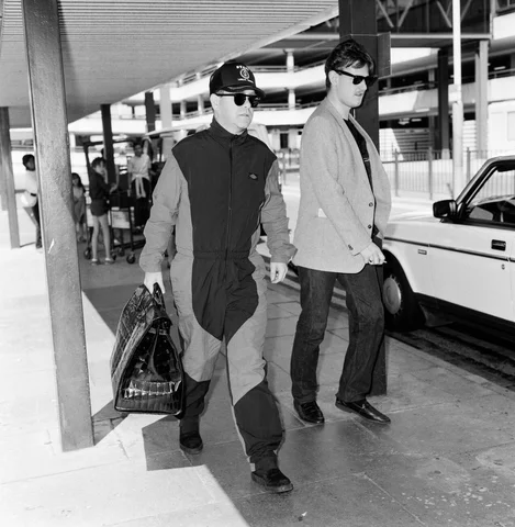 Elton John at Heathrow Airport, London. 16th July 1987.