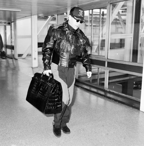 Elton John at Heathrow Airport, London. 25th September 1987.