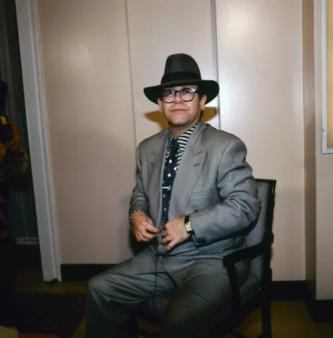 Portrait of British singer Elton John as he attends an unspecified event, London, England, September 30, 1987.