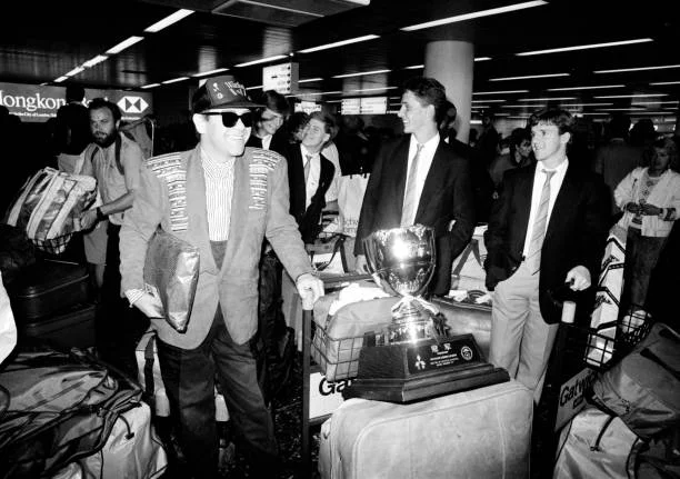 Watford FC Return From Tour In China CRAWLEY, ENGLAND - JUNE 4: Watford chairman Elton John and the rest of the team return to Gatwick Airport after their second tour of China on June 4, 1987 near Crawley, England