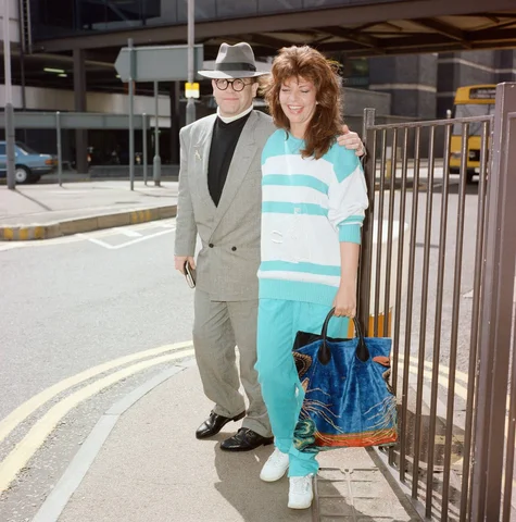 Elton John and his wife Renate at London Airport. 29th July 1988.