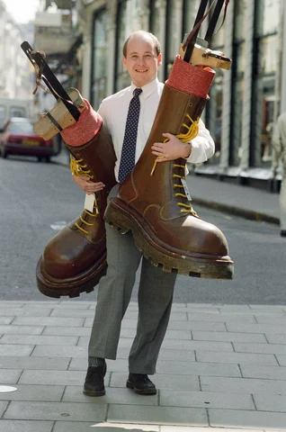 Sotheby's auction of Elton John items. Elton's famous Doc Martin boots were marched out of an auction for a record £11,000 - in he hands of their maker.