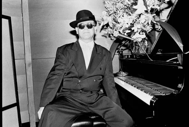 Elton John plays piano during a listening party at RCA Studios to promote his 'Reg Strikes Back' album, New York, New York, June 13, 1988.