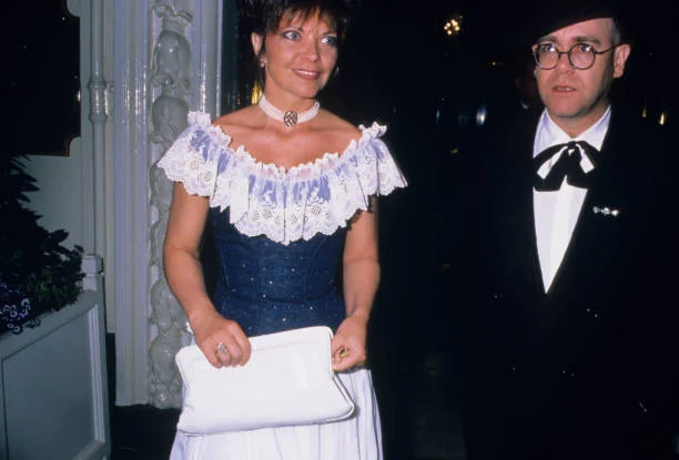 Elton John with his wife Renate Blauel at a gala charity performance of Barry Humphries' show 'Back With A Vengeance' at the Strand Theatre, London, 2nd May 1988.
