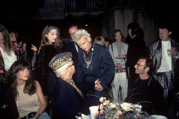 Elton John talks with Billy Idol at an after-party in Universal City in Los Angeles, California on August 24, 1989. The party followed a performance of 'Tommy' by The Who earlier at the Universal Amphitheatre. Billy performed with The Who in the show
