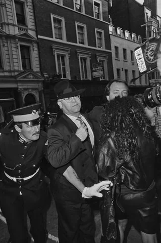 British singer Elton John arrives at his party being held at the Cartier store on Bond Street, London, 26th May 1989.