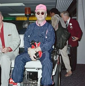 Elton John at London Heathrow Airport. 18th July 1990