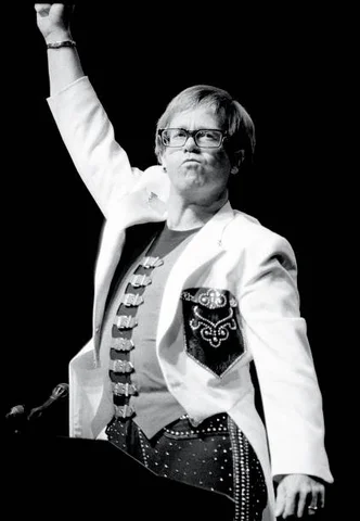 Sir Elton Hercules John is shown performing on stage during a “live" concert appearance on October 1, 1992 in Hartford, Connecticut