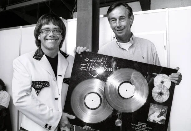 Elton John gets award in Holland from Jan Corduwener (Director/Presidentof Phonogram Holland), Feyenoord Stadium 'de Kuip', Rotterdam, 19th June 1992.