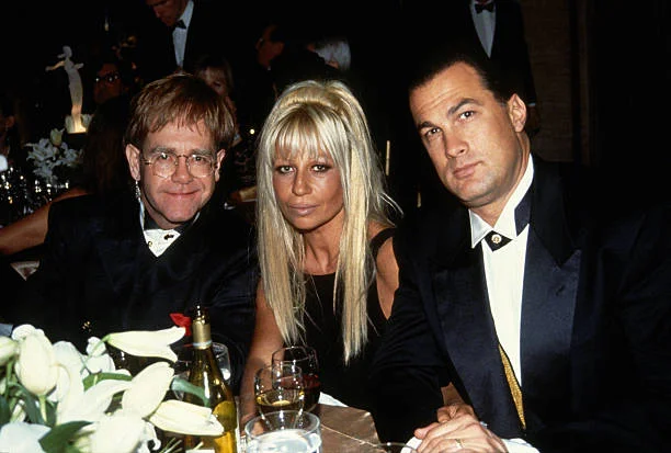Elton John, Donatella Versace and Steven Seagal attend the 12th Annual Council of Fashion Designers of America (CFDA) Awards at Lincoln Center circa 1993 in New York City.