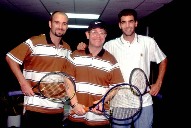 Elton John (center) poses with American tennis players Andre Agassi (left) and Pete Sampras, Chicago, Illinois, 1993.