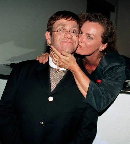 ATLANTA August 20: Elton John and Guest attend Elton John Aids Foundation charity hosted by his neighbors at Elton's Atlanta home Park Place Condo Tower in Buckhead Georgia, August 20, 1994