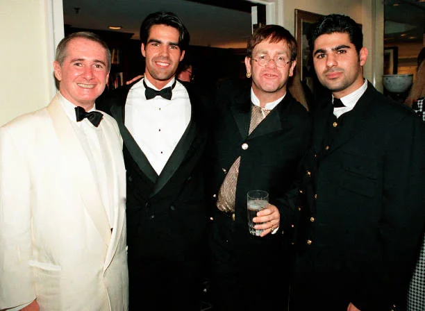 Elton John EJAF Event Park Place - 08-20-1994 ATLANTA August 20: John Reid, Guest, Elton John and Guest attend Elton John Aids Foundation charity hosted by his neighbors at Elton's Atlanta home Park Place Condo Tower in Buckhead Georgia, August 20, 1994