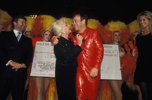 Party Against AIDS At The Moulin Rouge Cabaret Alain-Dominique Perrin, Line Renaud, Elton John and Claudia Schiffer at party against AIDS at the Moulin Rouge cabaret on October 11, 1994 in Paris, France
