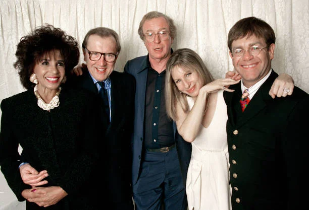 Barbra Streisand Concert - Backstage at Wembley LONDON, ENGLAND - APRIL 20: (L-R) Shirley Bassey, David Frost, Michael Caine, Barbra Streisand and Elton John pose together backstage at Streisand's concert at Wembley Arena in London, England