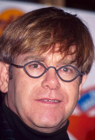 ELTON JOHN AT COMMEMORATES WORLD AIDS DAY IN HARD ROCK CAFE NEW YORK CITY 11-16-1995
