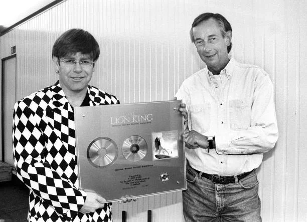 Elton John, gets award in Holland from Jan Corduwener (Director/Presidentof Phonogram Holland), Maaspop, Mullerpier, Rotterdam, Netherlands, 21st May 1995