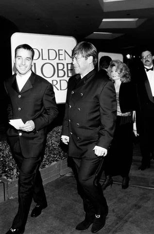 The 52nd Annual Golden Globe Awards Elton John and David Furnish attend the 52nd Annual Golden Globe Awards, at the Beverly Hilton Hotel on January 21, 1995, in Beverly Hills, CA.