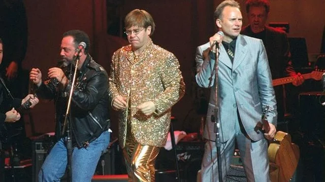 From left, Billy Joel, Elton John and Sting perform at a benefit concert for the Rainforest Foundation in 1995. Joel and John toured together often during their careers